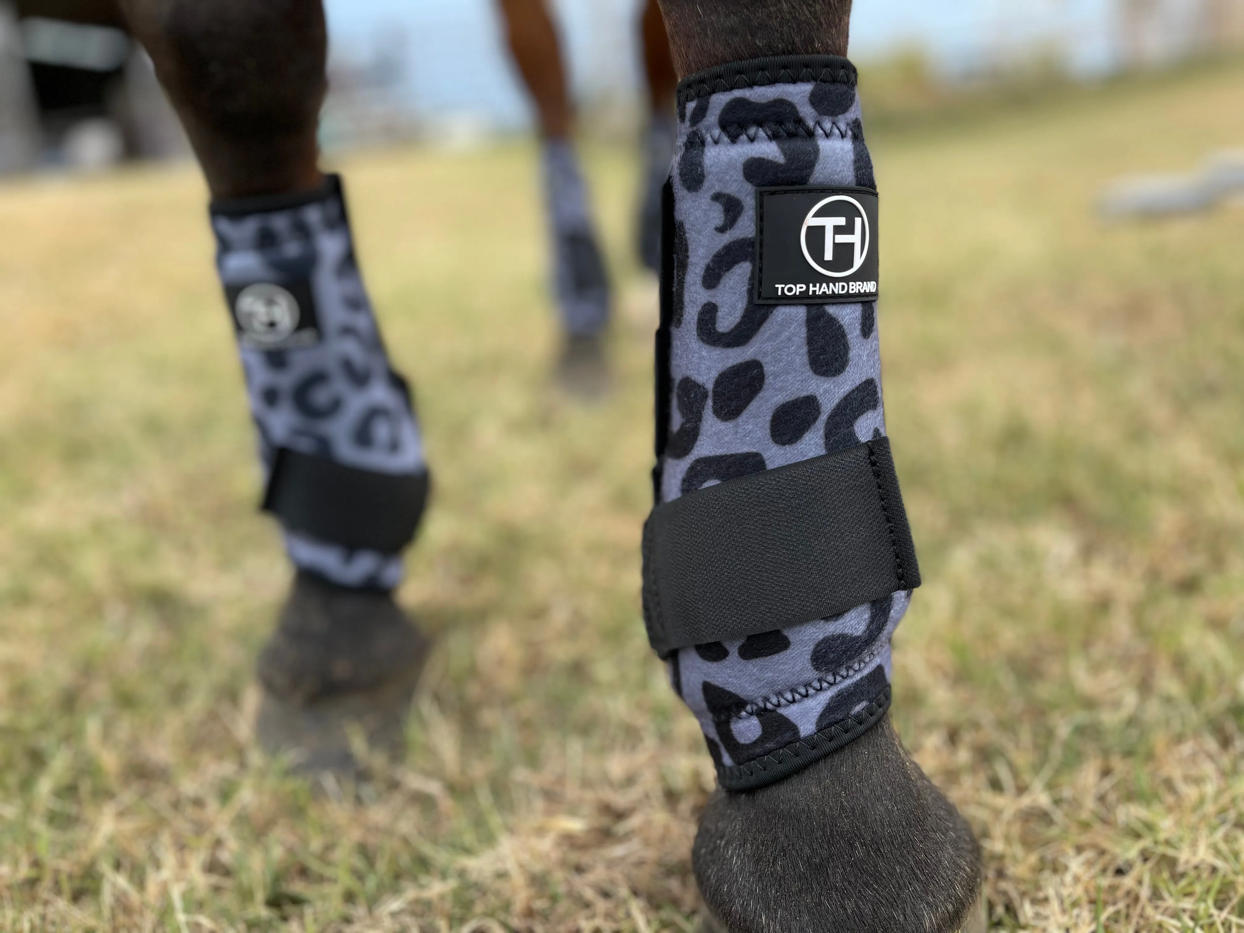 Gray cheetah sport boots
