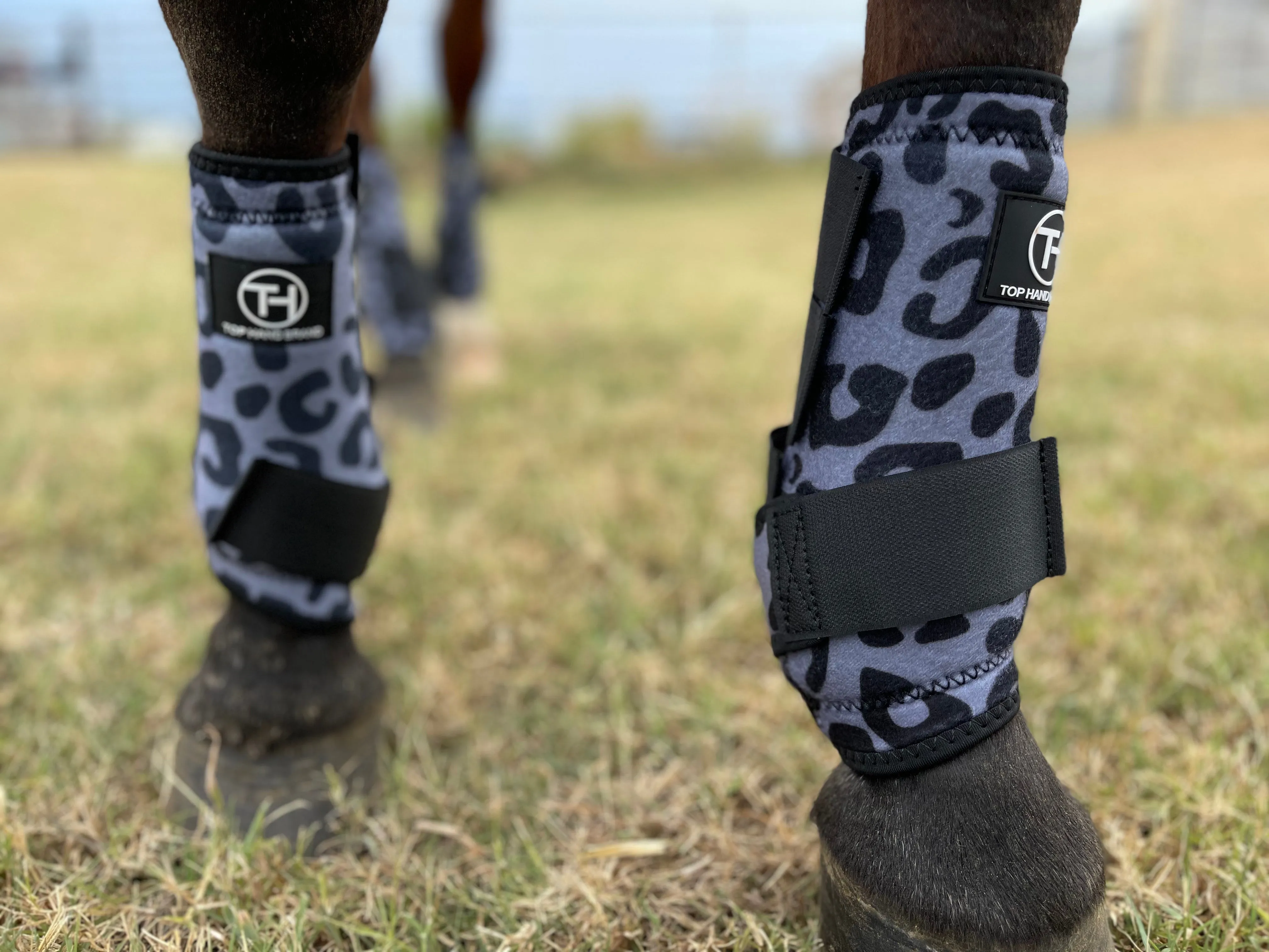 Gray cheetah sport boots